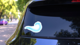 Grunge Light Blue Wave Sticker on a Rear Car Window (New) example