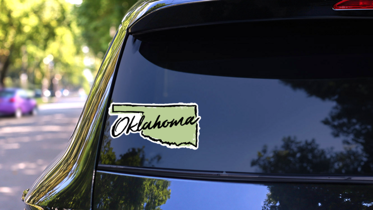 Hand Drawn Oklahoma State Sticker on a Rear Car Window (New) example