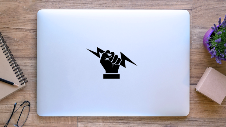 Hand Holding Lightning Bolt Sticker on a Laptop (New) example