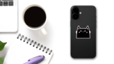 Happy Black Cat Head Face Sticker on a Phone (New) example