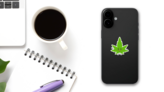 Happy Cartoon Marijuana Leaf Sticker on a Phone (New) example