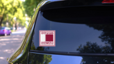 Happy Qatar Independence Day Square Sticker on a Rear Car Window (New) example