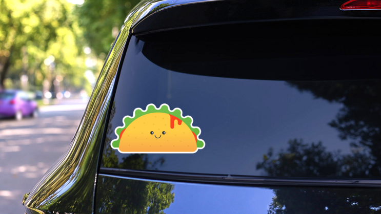 Happy Taco With Hot Sauce Sticker on a Rear Car Window (New) example