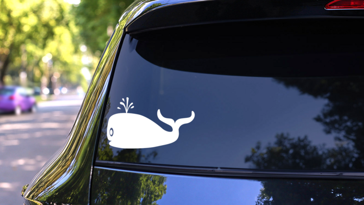 Happy Whale Blowing Out Water Sticker on a Rear Car Window (New) example