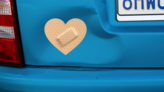 Heart Band Aid Bandage Sticker on a Dented Car example