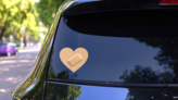 Heart Band Aid Bandage Sticker on a Rear Car Window (New) example