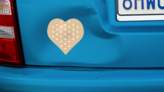 Heart Shaped Bandage Sticker on a Dented Car example