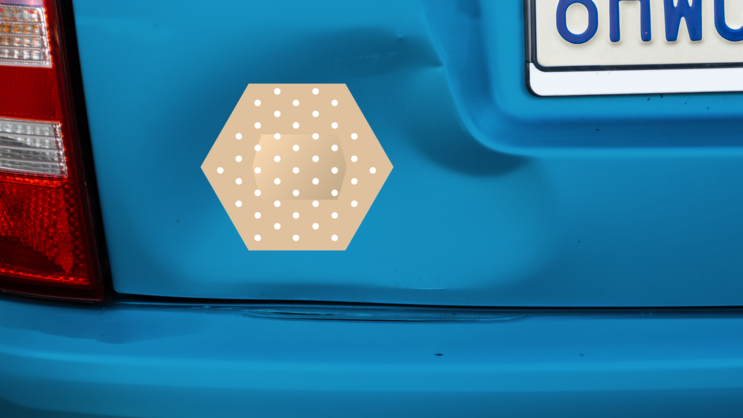 Hexagon Band Aid Bandage Sticker on a Dented Car example