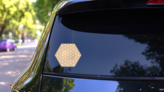 Hexagon Band Aid Bandage Sticker on a Rear Car Window (New) example