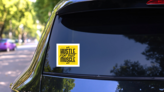 Hustle for That Muscle Inspirational Sticker on a Rear Car Window (New) example