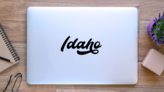 Idaho Modern Calligraphy Script Sticker on a Laptop (New) example