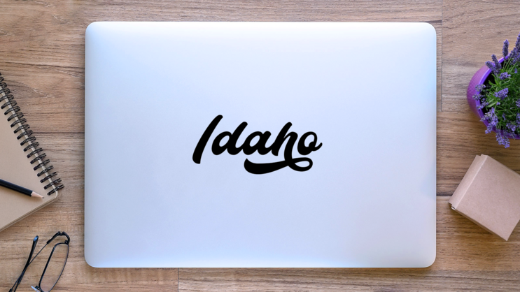Idaho Modern Calligraphy Script Sticker on a Laptop (New) example