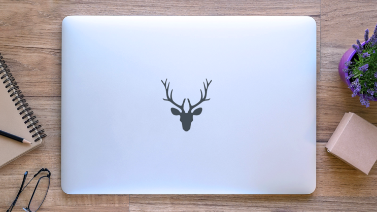 Illustration Of A Deer Head Silhouette Sticker on a Laptop (New) example