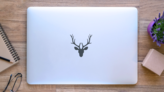 Illustration Of A Deer Head Silhouette Sticker on a Laptop (New) example
