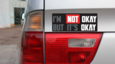 Im Not Okay But Its Okay  Bumper Sticker on a Gold Car Rear Bumper example