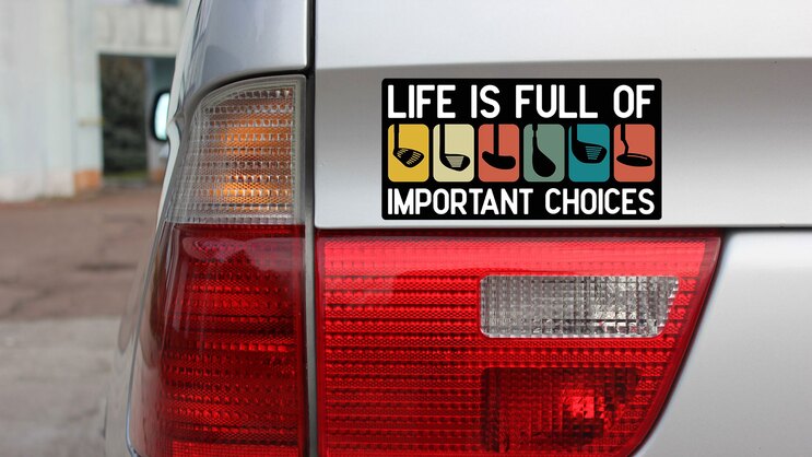 Important Choices Golf Bumper Sticker on a Gold Car Rear Bumper example