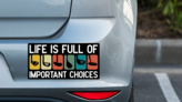Important Choices Golf Bumper Sticker on a Grey Car Bumper example