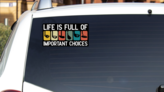 Important Choices Golf Bumper Sticker on a White Car Rear Window example
