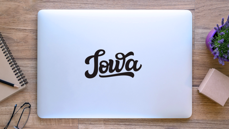 Iowa Calligraphy Sticker on a Laptop (New) example