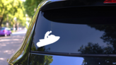 Jet Skier In Air Sticker on a Rear Car Window (New) example