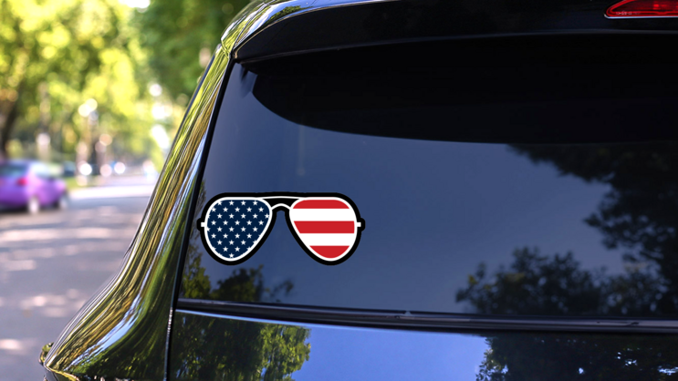 Joe Biden American Flag Sunglasses Sticker on a Rear Car Window (New) example