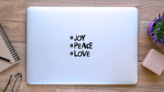 Joy, Peace, Love New Years Day Sticker  on a Laptop (New) example