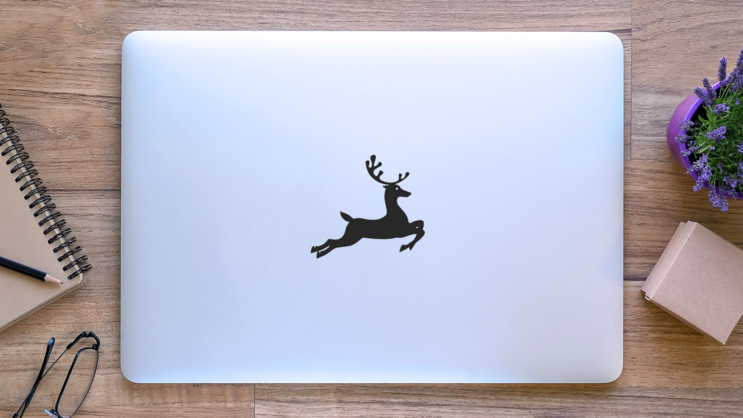 Jumping Reindeer Sticker on a Laptop (New) example