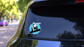 Jumping Snowboarder Blue Circle Sticker on a Rear Car Window (New) example
