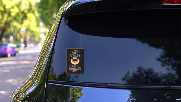 Keep Calm And Eat Croissant Sticker on a Rear Car Window (New) example