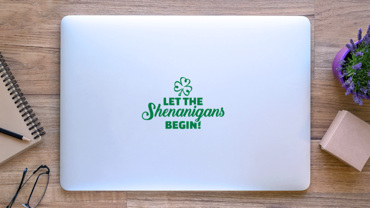 Let the Shenanigans Begin Sticker on a Laptop (New) example