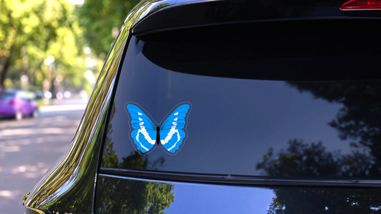 Light Blue Butterfly Sticker on a Rear Car Window (New) example
