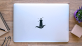 Lighthouse On Wave Simple Sticker on a Laptop (New) example