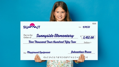Little Girl Holds Giant Check For New Playground