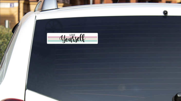 Love Yourself Bumper Sticker on a White Car Rear Window example