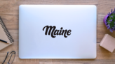 Maine Calligraphy Sticker on a Laptop (New) example