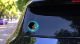 Man With Large Afro Smoking Joint Sticker on a Rear Car Window (New) example
