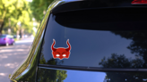 Mask Of The Devil With Horns Sticker on a Rear Car Window (New) example
