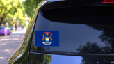Michigan Mi State Flag Sticker on a Rear Car Window (New) example