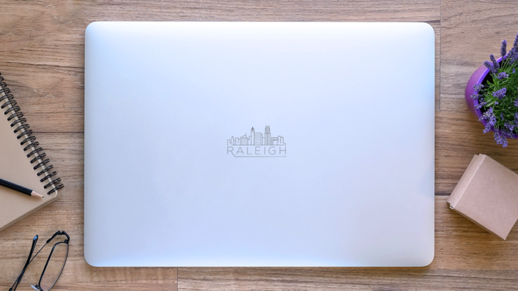 Minimal Raleigh Linear City Skyline Sticker on a Laptop (New) example
