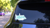 Modern Silhouette Of The New York City Skyline Turquoise Sticker on a Rear Car Window (New) example