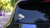 Monochrome Vintage Human Brain With Wind Up Key Sticker on a Rear Car Window (New) example