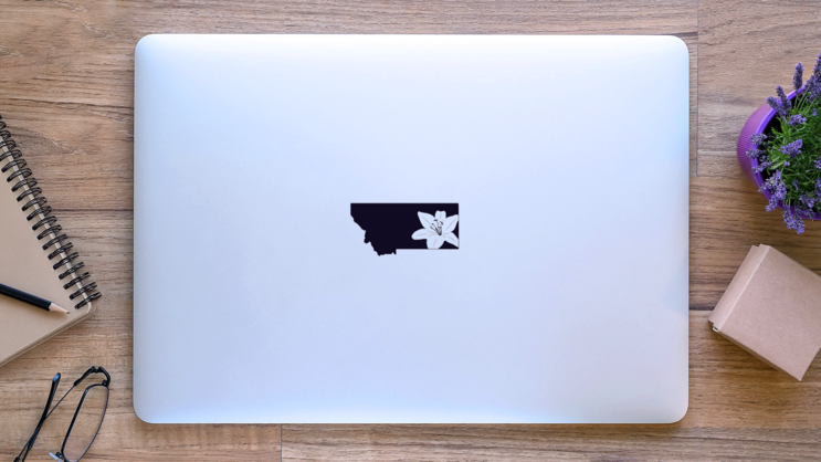 Montana With Lily Flower Sticker on a Laptop (New) example