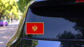 Montenegro Flag Sticker on a Rear Car Window (New) example