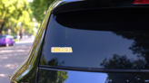 Nebraska Yellow Neon Style Lettering Sticker on a Rear Car Window (New) example