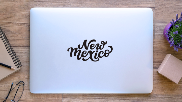 New Mexico Calligraphy Sticker on a Laptop (New) example