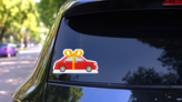 New Red Car With Gold Bow Sticker on a Rear Car Window (New) example