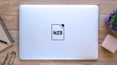 New Zealand Dollar Sign Icon Sticker on a Laptop (New) example
