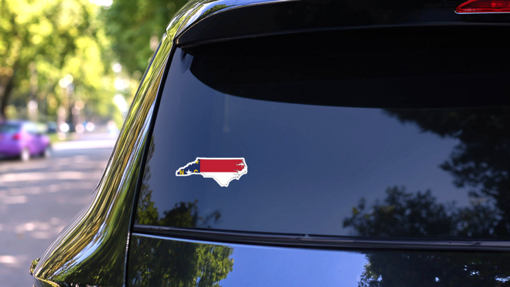 North Carolina Map With The Flag Inside Sticker on a Rear Car Window (New) example