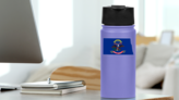 North Dakota Flag State Sticker on a Water Bottle (New) example