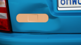 Oblong Band Aid Sticker on a Dented Car example